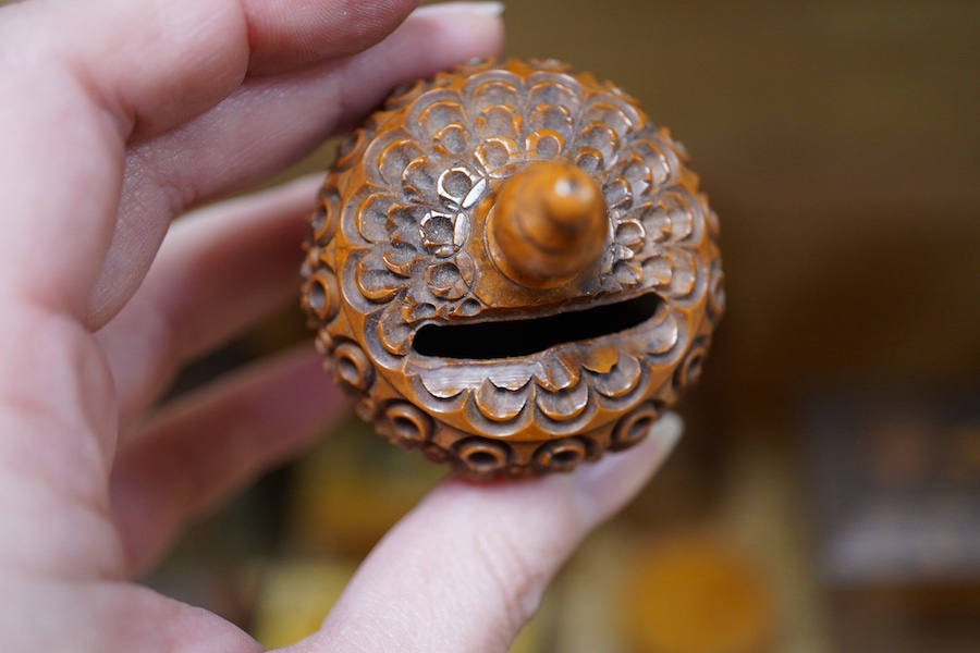 A 19th century Tunbridgeware tea caddy, 20cm wide, 11cm high, a Coquilla nut miniature money box and a collection of mixed decorative and novelty wooden money boxes (17). Condition - poor to fair